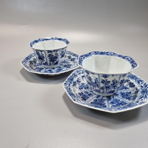 169 - Pair of Chinese blue and white octagonal tea bowls and saucers, decorated to the front and reverse w... 