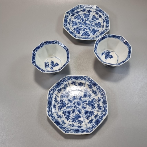 169 - Pair of Chinese blue and white octagonal tea bowls and saucers, decorated to the front and reverse w... 