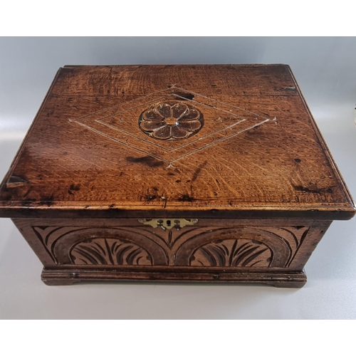 185 - 18th century oak box, of rectangular form, the hinged lid carved with lozenge panel and relief flowe... 