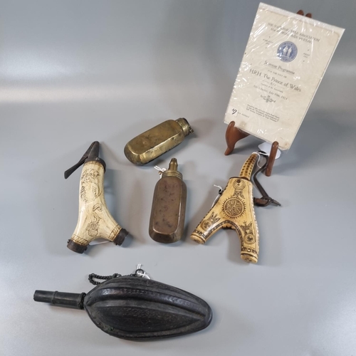 206 - Group of unusual powder and shot flasks, to include: egg shaped worked leather shot flask, probably ... 