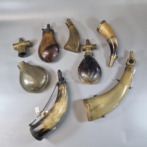 208 - Interesting group of 19th century moulded horn and natural horn powder and shot flasks, all with var... 