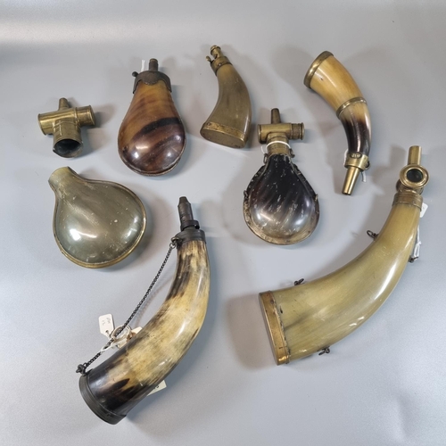 208 - Interesting group of 19th century moulded horn and natural horn powder and shot flasks, all with var... 