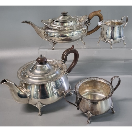 226 - Three piece silver tea service, by Walker & Hall Sheffield, having pierced rim mounts, two with the ... 