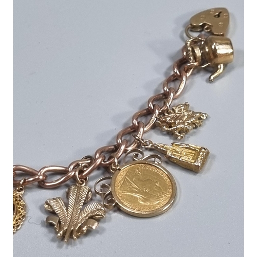 246 - 9ct gold charm bracelet comprising full and half sovereign in 9ct mounts dated 1912 and 1897 respect... 