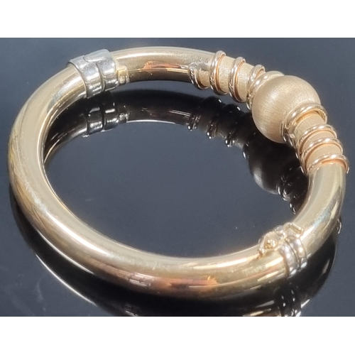 256 - 14ct gold two tone modernist bangle.  32g.2g.  (B.P. 21% + VAT)