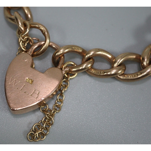 261 - 9ct gold curblink bracelet with heart padlock.  32.5g approx.  (B.P. 21% + VAT)