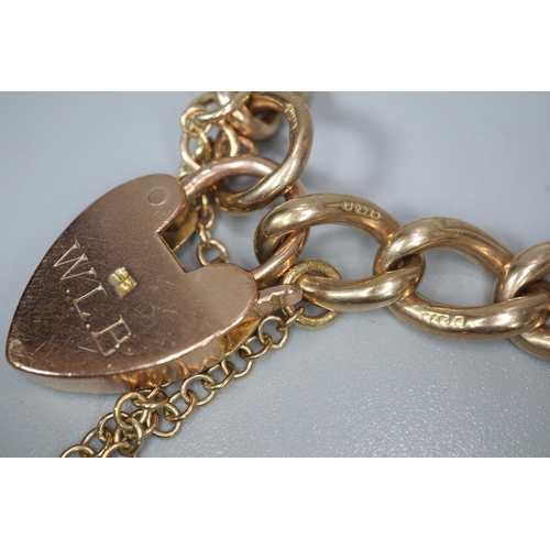 261 - 9ct gold curblink bracelet with heart padlock.  32.5g approx.  (B.P. 21% + VAT)