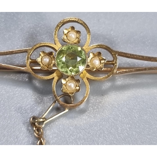 264 - Edwardian 15ct gold Peridot and Seed Pearl brooch.  5.7cm long approx.  4.8g approx.  (B.P. 21% + VA... 