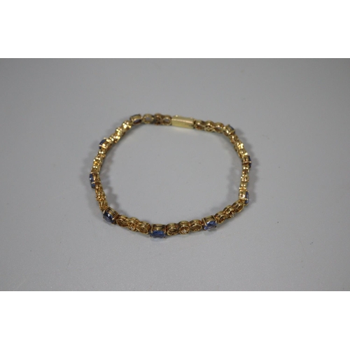 272 - 18ct gold 19 stone diamond and sapphire bracelet.  18.5cm long approx.  (B.P. 21% + VAT)