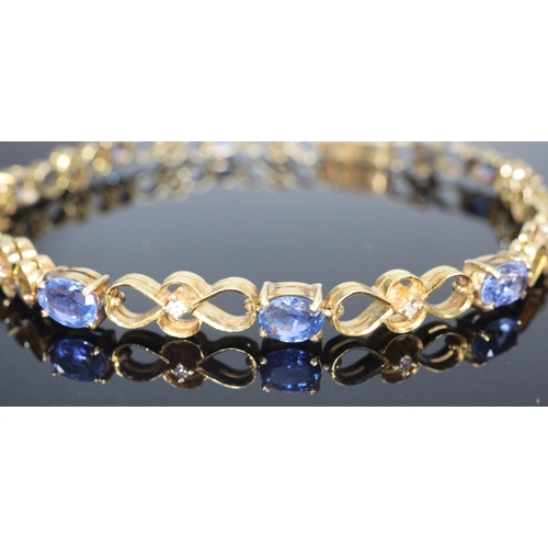 272 - 18ct gold 19 stone diamond and sapphire bracelet.  18.5cm long approx.  (B.P. 21% + VAT)