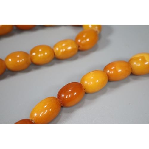 275 - Amber Butterscotch necklace.  59g approx.  The largest bead  2.5cm long approx.  (B.P. 21% + VAT)