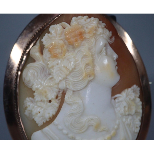 282 - Large Victorian 9ct gold cameo portrait brooch.  7x6cm approx.  Together with another 9ct gold cameo... 