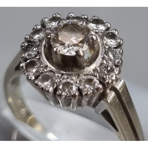 284 - 18ct white gold diamond cluster ring.  6.2g approx.  Ring size N 1/2.   (B.P. 21% + VAT)