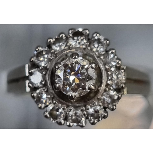 284 - 18ct white gold diamond cluster ring.  6.2g approx.  Ring size N 1/2.   (B.P. 21% + VAT)