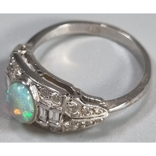 285 - 18ct white gold Art Deco style ring with central oval opal surrounded by baguette and other diamonds... 