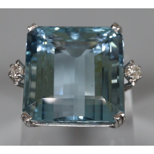 288 - 18ct white gold aquamarine ring, aqua marine stone 2x1.8cm approx.,   flanked by two small diamonds.... 