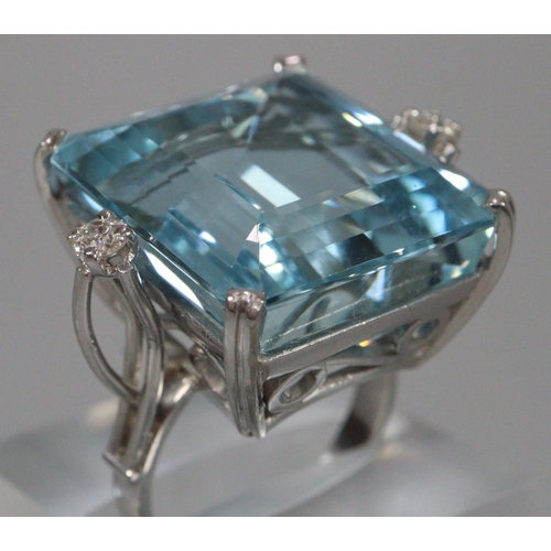 288 - 18ct white gold aquamarine ring, aqua marine stone 2x1.8cm approx.,   flanked by two small diamonds.... 