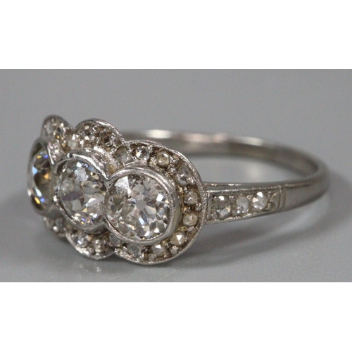 292 - White gold Art Deco triple cluster diamond ring, appearing unmarked.  Size M1/2.  3.3g approx.  (B.P... 