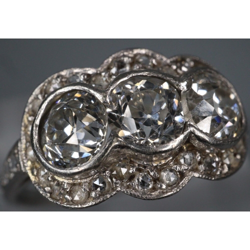 292 - White gold Art Deco triple cluster diamond ring, appearing unmarked.  Size M1/2.  3.3g approx.  (B.P... 