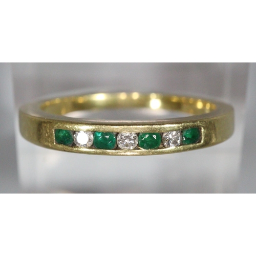 302 - 18ct gold diamond and emerald seven stone hoop ring. Ring size N, 3.6g approx.
(B.P. 21% + VAT)