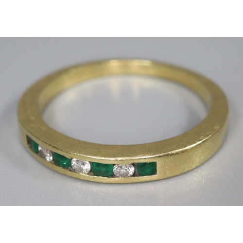 302 - 18ct gold diamond and emerald seven stone hoop ring. Ring size N, 3.6g approx.
(B.P. 21% + VAT)