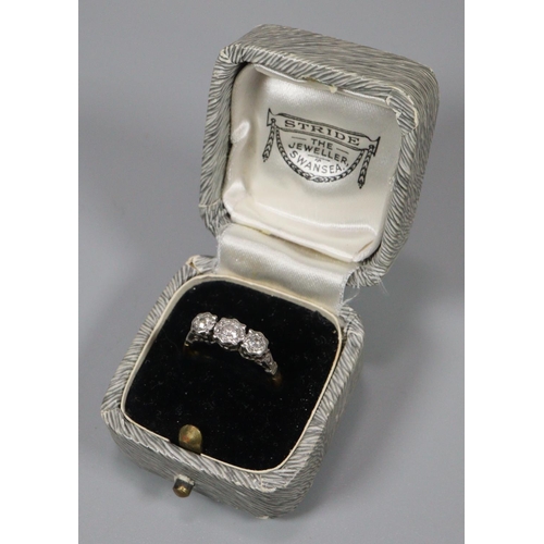 305 - 18ct platinum three stone diamond ring, marked 18ct Plat.  Size L.  2.5g approx.   (B.P. 21% + VAT)