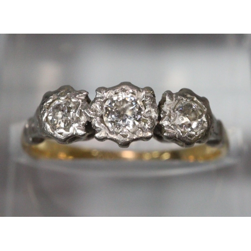 305 - 18ct platinum three stone diamond ring, marked 18ct Plat.  Size L.  2.5g approx.   (B.P. 21% + VAT)