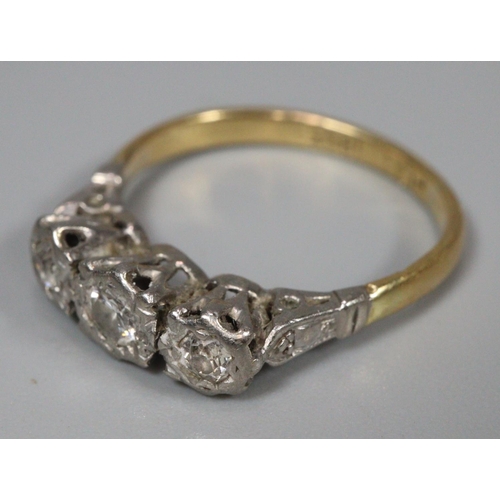 305 - 18ct platinum three stone diamond ring, marked 18ct Plat.  Size L.  2.5g approx.   (B.P. 21% + VAT)