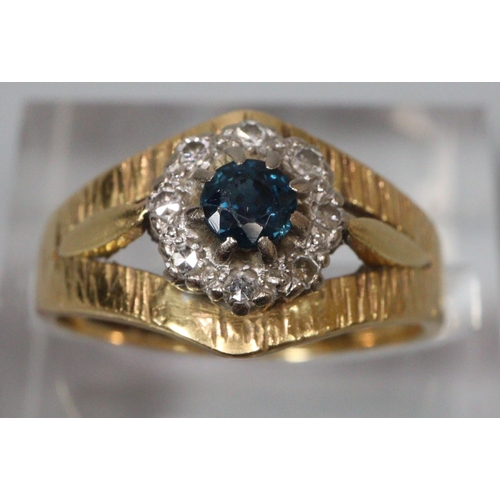 306 - 18ct gold bark finish diamond and sapphire ring. Size K1/2.   4.6g approx.  (B.P. 21% + VAT)