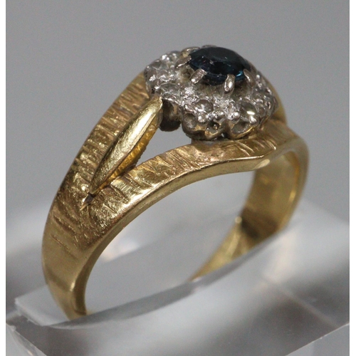 306 - 18ct gold bark finish diamond and sapphire ring. Size K1/2.   4.6g approx.  (B.P. 21% + VAT)