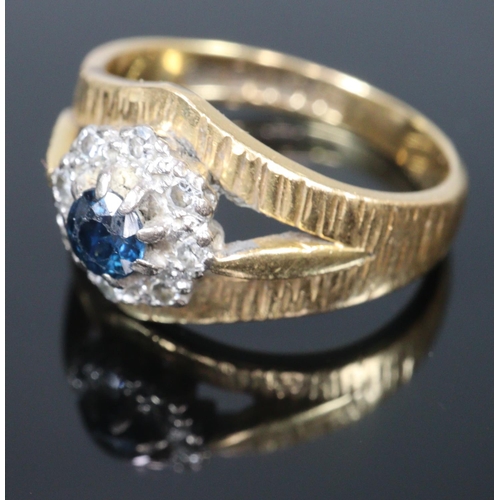 306 - 18ct gold bark finish diamond and sapphire ring. Size K1/2.   4.6g approx.  (B.P. 21% + VAT)