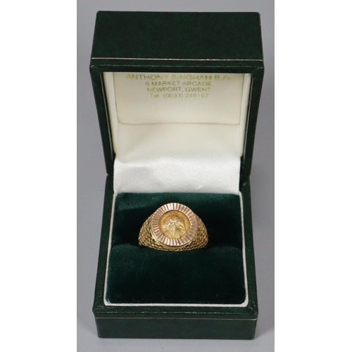 311 - 18ct gold coin ring, the reverse appearing to be decorated with a relief bird.  Size Q.  7g approx. ... 