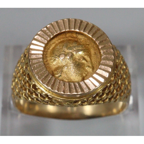 311 - 18ct gold coin ring, the reverse appearing to be decorated with a relief bird.  Size Q.  7g approx. ... 