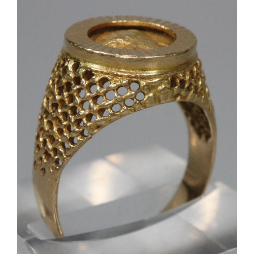 311 - 18ct gold coin ring, the reverse appearing to be decorated with a relief bird.  Size Q.  7g approx. ... 