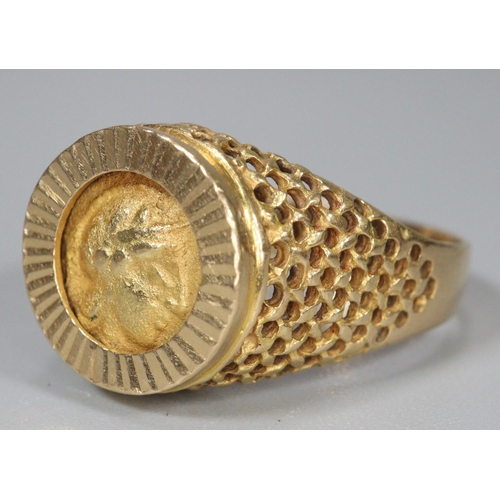 311 - 18ct gold coin ring, the reverse appearing to be decorated with a relief bird.  Size Q.  7g approx. ... 