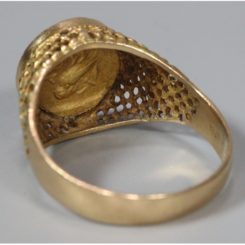 311 - 18ct gold coin ring, the reverse appearing to be decorated with a relief bird.  Size Q.  7g approx. ... 