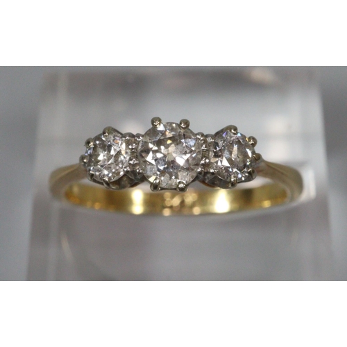 312 - 18ct gold three stone diamond ring.  Ring size N1/2.  3.1g approx.   (B.P. 21% + VAT)