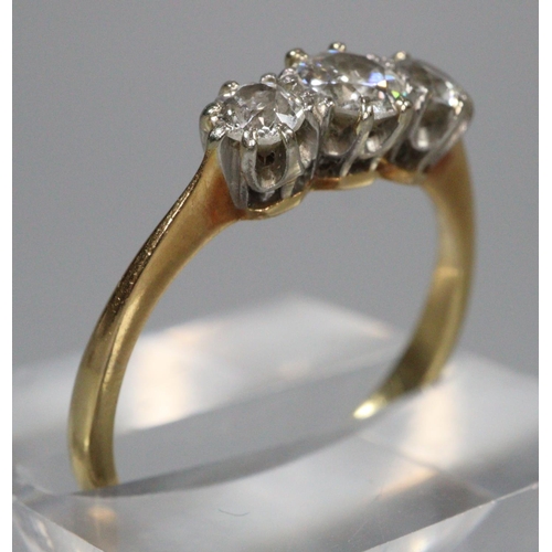 312 - 18ct gold three stone diamond ring.  Ring size N1/2.  3.1g approx.   (B.P. 21% + VAT)