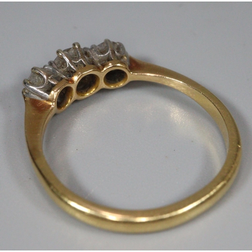 312 - 18ct gold three stone diamond ring.  Ring size N1/2.  3.1g approx.   (B.P. 21% + VAT)