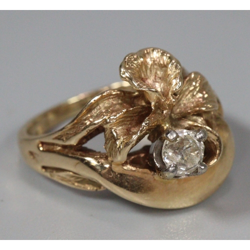 315 - Yellow metal floral design diamond solitaire ring. 6.1g approx.  Ring size J1/2.   0.2ct approx.  (B... 