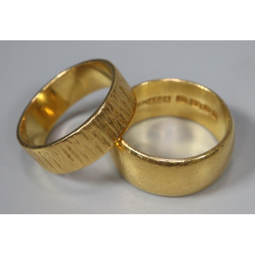 316 - Two 22ct gold wedding bands, one of textured design.  13.4g approx.  (B.P. 21% + VAT)