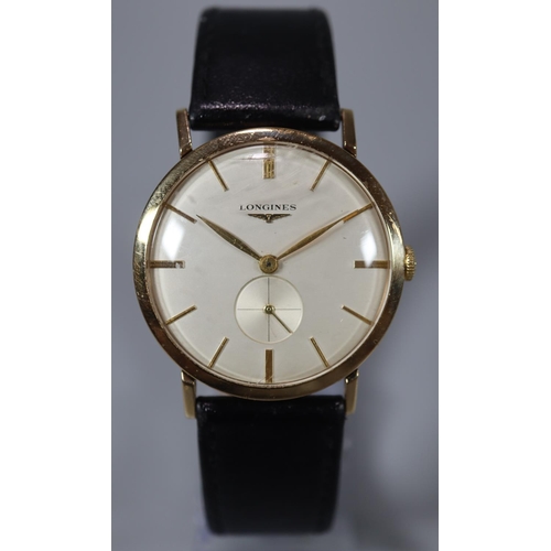 319 - Longines gold gentleman's mechanical dress watch, having satin face with baton numerals and seconds ... 