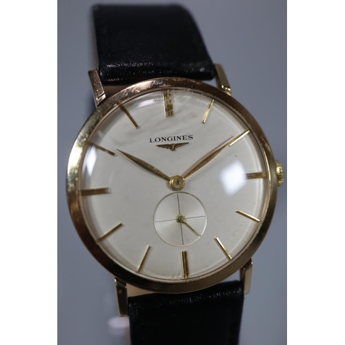 319 - Longines gold gentleman's mechanical dress watch, having satin face with baton numerals and seconds ... 