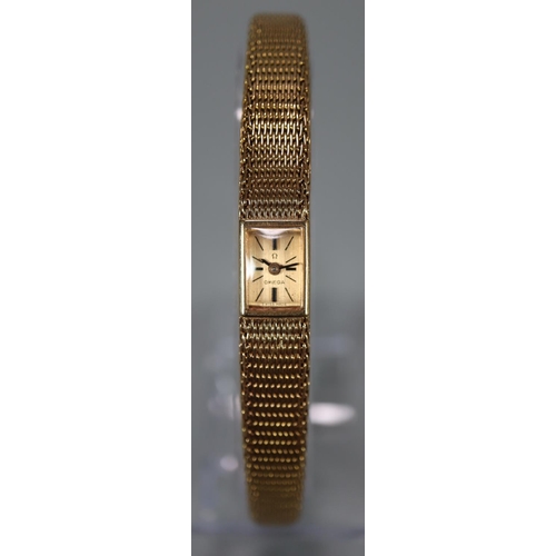 324 - Vintage ladies Omega 18ct gold slimline design wristwatch, the rectangular face marked 'Omega Swiss ... 