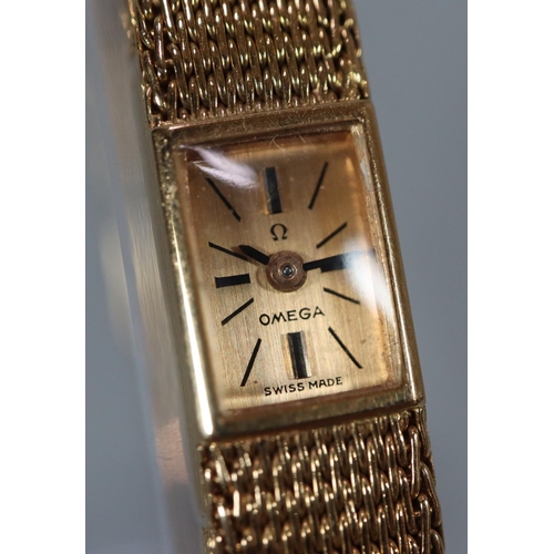 324 - Vintage ladies Omega 18ct gold slimline design wristwatch, the rectangular face marked 'Omega Swiss ... 