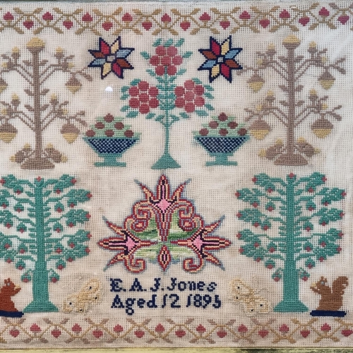 349 - Late Victorian child's sampler, E. A. J. Jones, Aged 12, dated 1895, overall decorated with flowers,... 