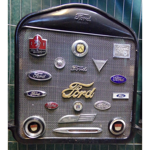 363 - Vintage Model T Ford radiator grill set with various Ford vehicle badges, including: Ford V8, Script... 