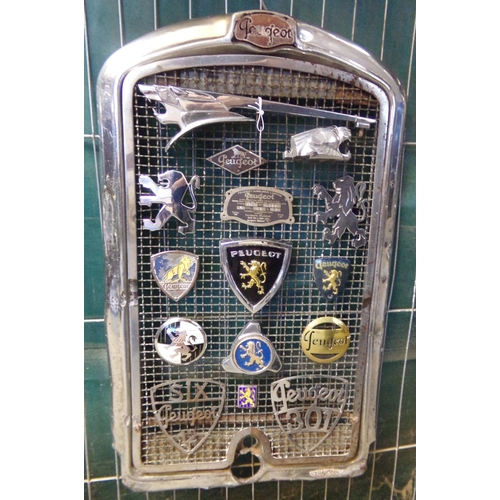 369 - Pre War Peugeot chrome radiator grill set with a number of Peugeot bonnet motifs and vehicle badges,... 