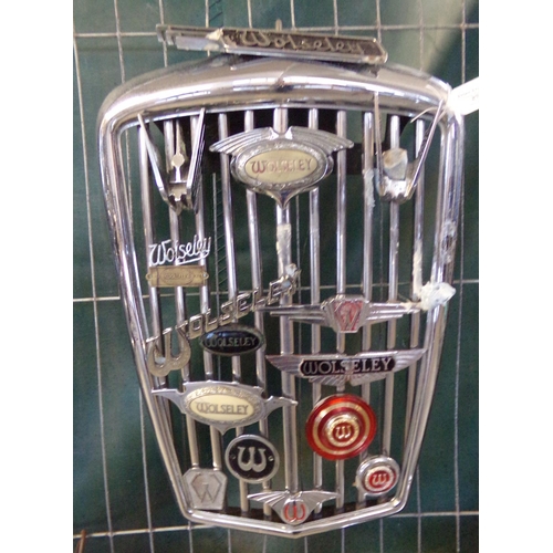 373 - Post war Wolseley chrome radiator grill set with an assortment of Wolseley car badges and scripts.  ... 