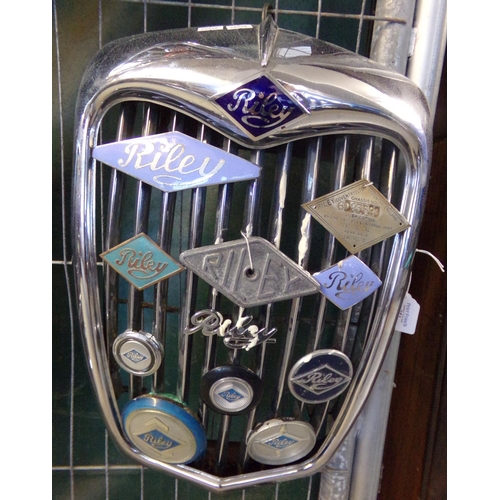 374 - Post war Riley chrome radiator grill set with various and assorted Riley vehicle badges and scripts.... 